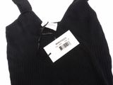a close up of a black sweater with a price tag on it
