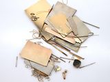 a pile of metal scraps on a white surface