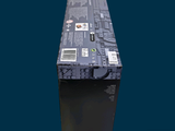 a black box with a label on it sitting on a blue surface
