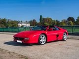 a red sports car parked on the side of the road