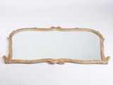 an antique gold mirror with a wooden frame and a white background