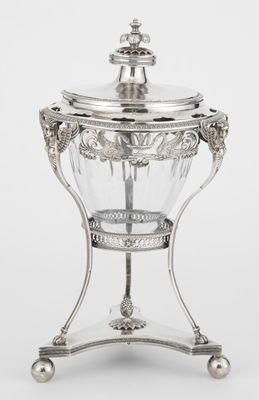 an antique silverplated glass covered bowl on stand