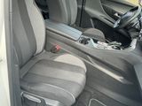 the interior of a car with the door open showing the front seats