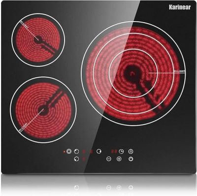 an image of a black and red stove top with four burners