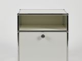 an image of a small white cabinet with a drawer underneath it