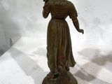 pair of antique bronze figurines of a woman holding a gun