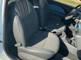 a small car with two seats and a steering wheel