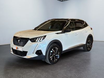 a white suv parked in a room with a black floor