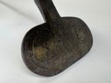a metal object that is sitting on a white surface