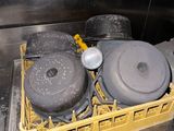 pots and pans are sitting in a dishwasher in a kitchen