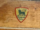 a close up of a wooden box with a logo on it