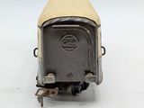 an old fashioned toy train car sitting on top of a white surface