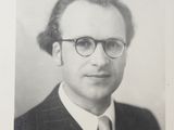 an old black and white photo of a man in a suit and tie