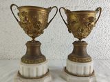 two vases that are sitting on top of each other