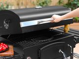 a person that is cooking food on a grill