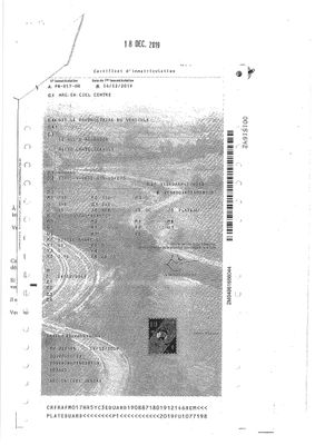 une image représentant une photo en noir et blanc d'un document sur lequel figure la photo d'un homme