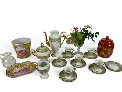 many different types of tea cups and saucers on the table