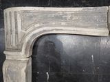 a marble fireplace mantle with a bird on it