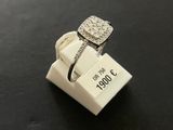a close up of a ring with a diamond on top of it
