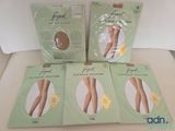 four packs of footless stockings sitting on top of a white table