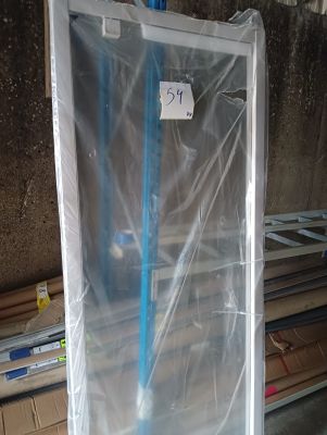 a blue broom that is sitting in a plastic box
