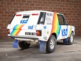 a van that is parked in front of a brick wall