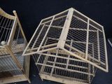 two cages that are sitting next to each other on the floor