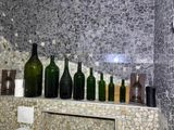 many bottles on the shelf in the bathroom