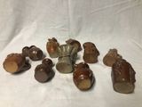 a lot of small figurines that are sitting on a table