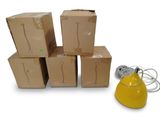 four boxes stacked on top of each other next to a lamp