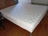 a mattress that is sitting on top of a wooden table