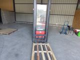 a forklift that is sitting in a garage