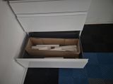 a box with toilet paper in it sitting on the floor