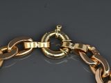 an image of a close up of a gold bracelet on a table
