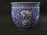 a blue and white vase sitting on a table