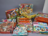 several children ' s books are stacked on top of each other