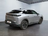 the rear end of a silver suv parked in a garage