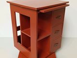 a small wooden table with a drawer on it