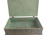 an image of a green box sitting on top of a white surface