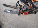a chainsaw that is sitting on the ground next to a car