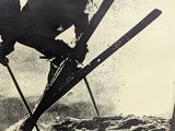 a black and white photo of a man on skis in the air