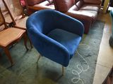 a blue chair and a brown chair in a room