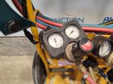 a close up of a machine with gauges and hoses