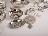 a lot of silver items that are on the table