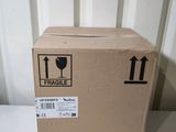 a cardboard box with a fragile label on it sitting on a table