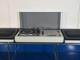 a picture of a record player sitting on top of a table