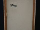 painting of a dragonfly on a white canvas on a wooden easel