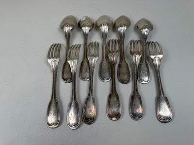 a lot of silver spoons and forks on a table