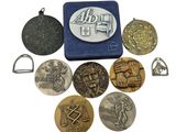 some coins are sitting on top of a blue case