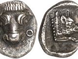 a close up of a coin with a goat on it